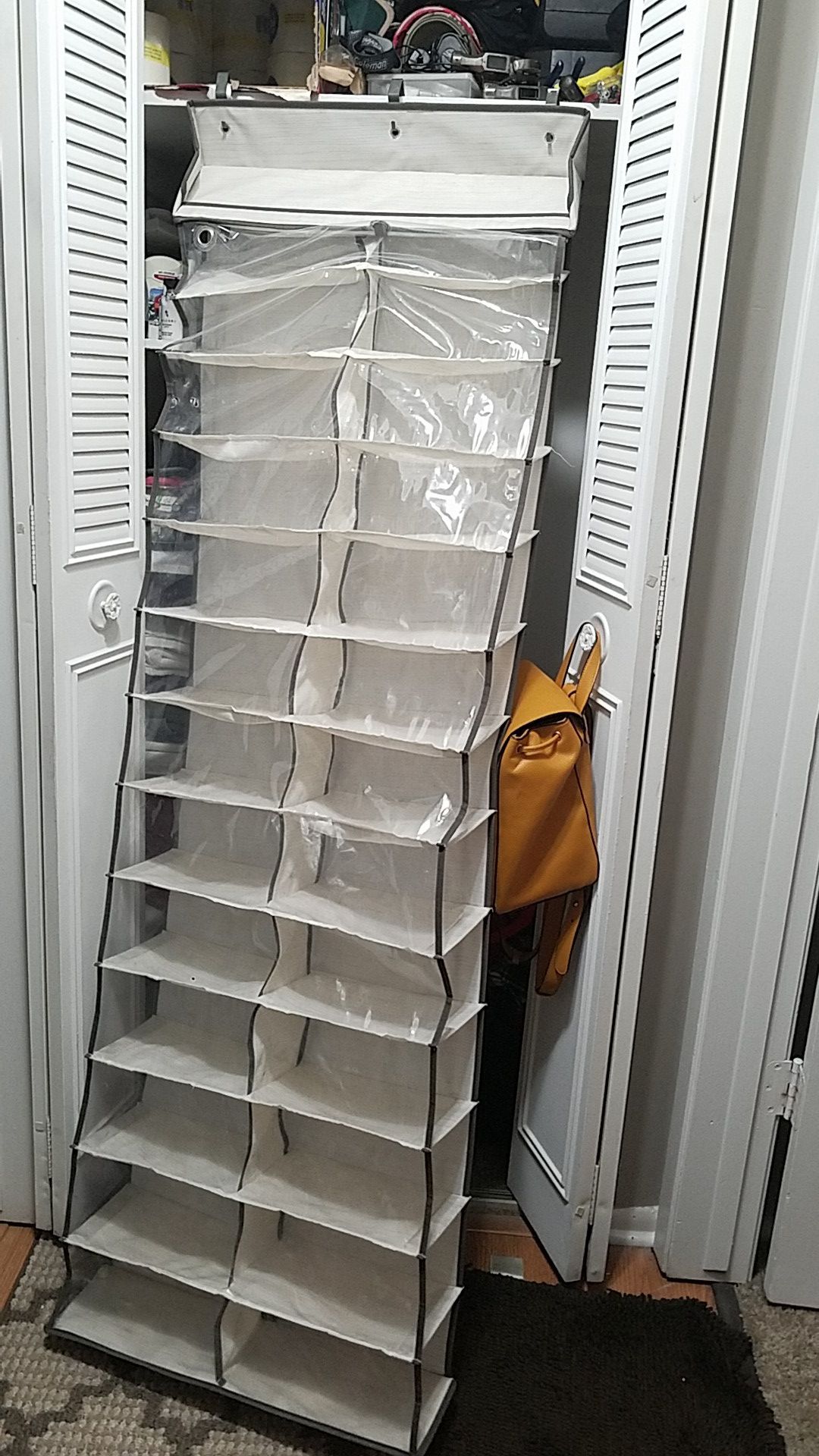 Shoes organizer on the door holds 26 pairs