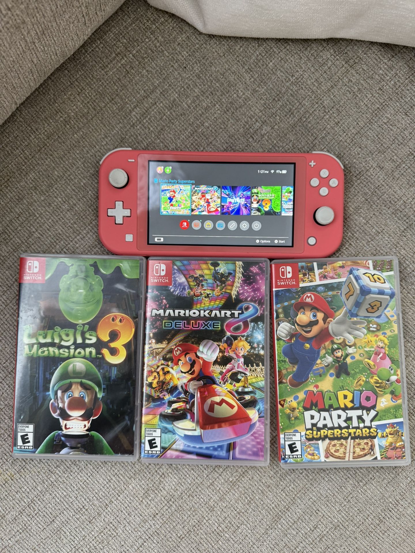 Pink Nintendo switch with games