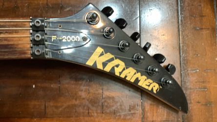 Kramer f 2000 guitar light green in color, but has specs of gold through the green