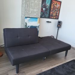 Futon And Pics On The Wall.