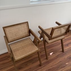 Two rattan back wood chairs