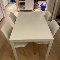 Expandable White Dining Table And Chairs