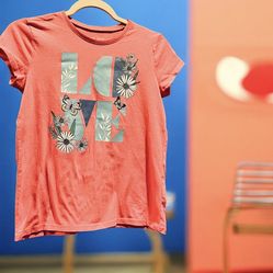 Girl's T-shirt, size 14 — excellent condition.