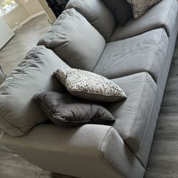 New sofa: gray three seater sofa