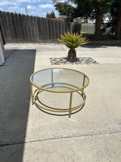 35” round glass coffee table.