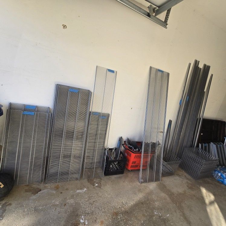 Selling a complete Elfa platinum closet storage set in excellent condition. Includes multiple shelving panels, hanging standards, brackets, mesh drawe