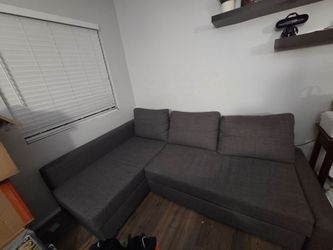Grey Couch with pull out section- good condition