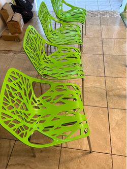 Set of 4 green chairs