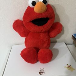 Is a stuffed doll of Elmo, specifically the popular toy "Tickle Me Elmo" from 1996.