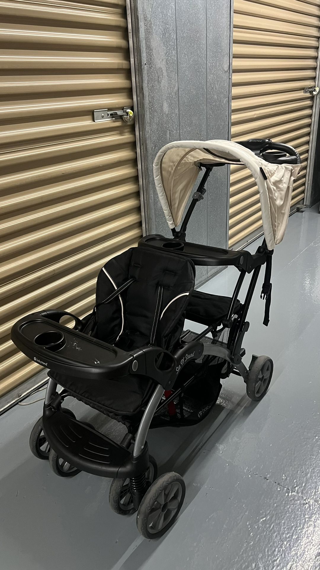 Baby Trend Double Infant and Toddler Stroller w/ Harness and Basket, Sit N' Stand, Khaki