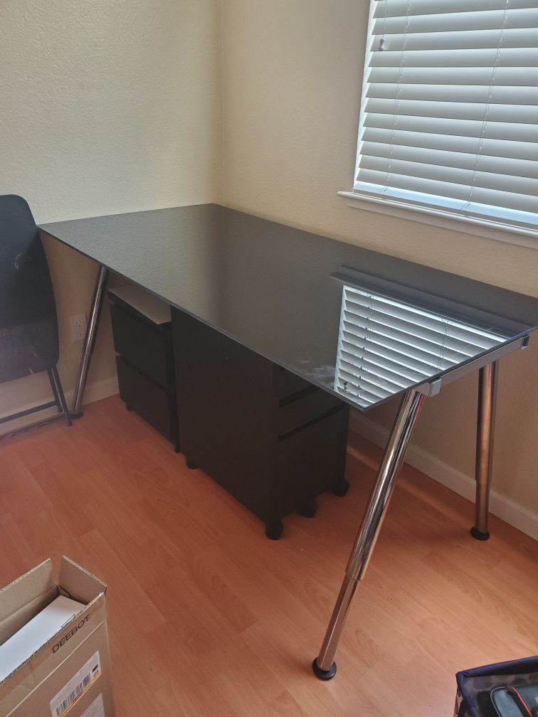 2x adjustable glass desks with Rolling Drawers