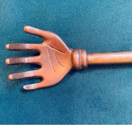Vintage hand made brass hand back scratcher with pineapple finial at top