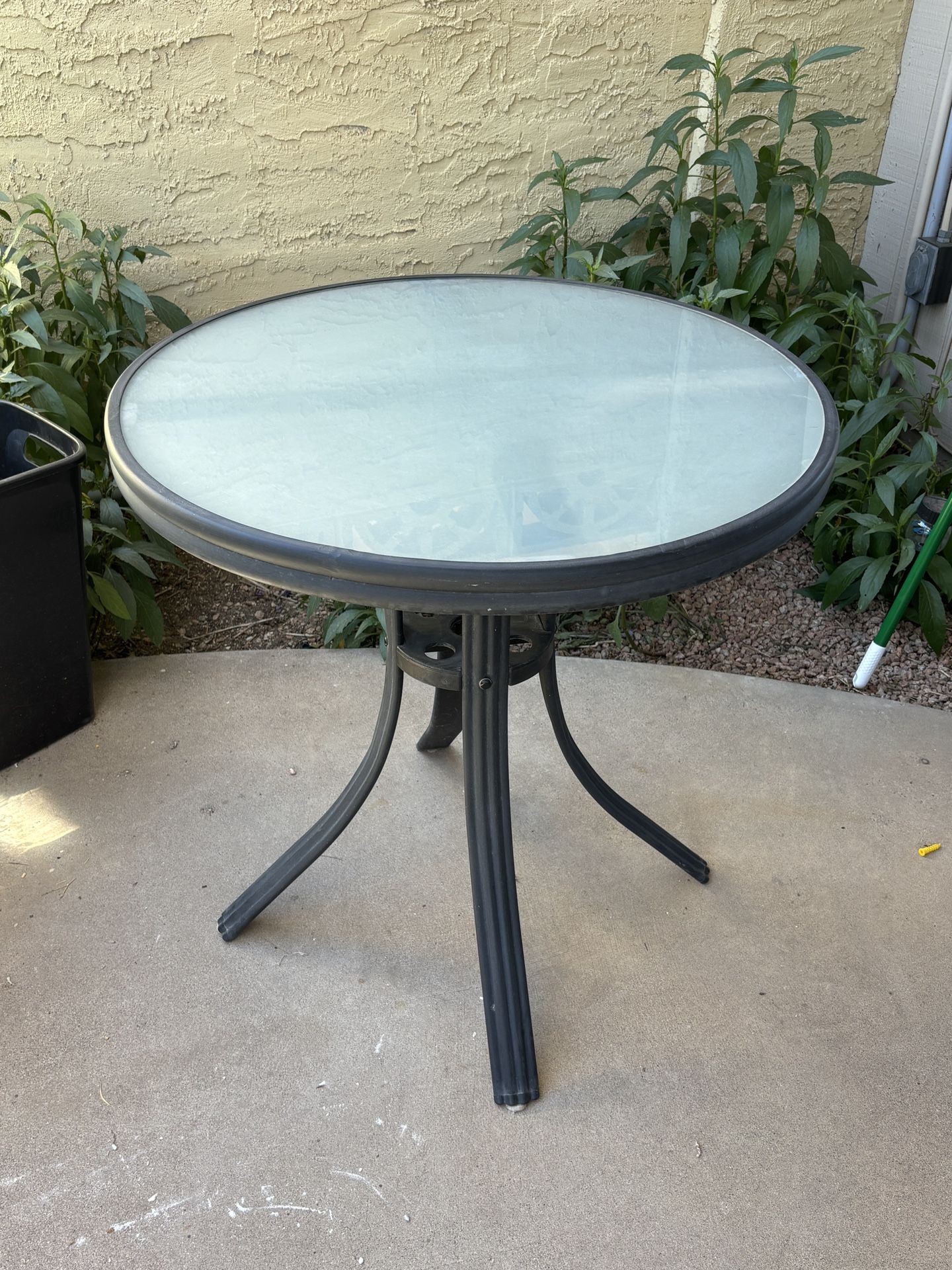 Heavy duty glass patio table.