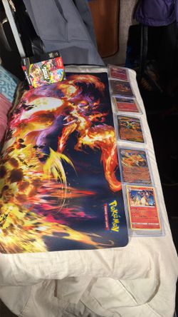 Pokémon Charizard special set I put together one Charizard map and Charizard cards in protective covers one free Charizard gold fan card one box of pl