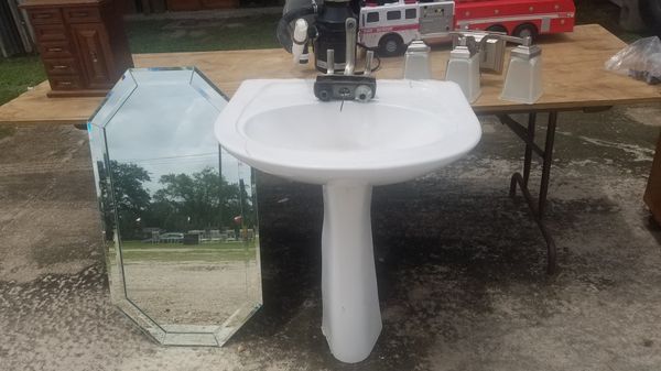 Pedestal sink with Kohler faucet and matching light ...