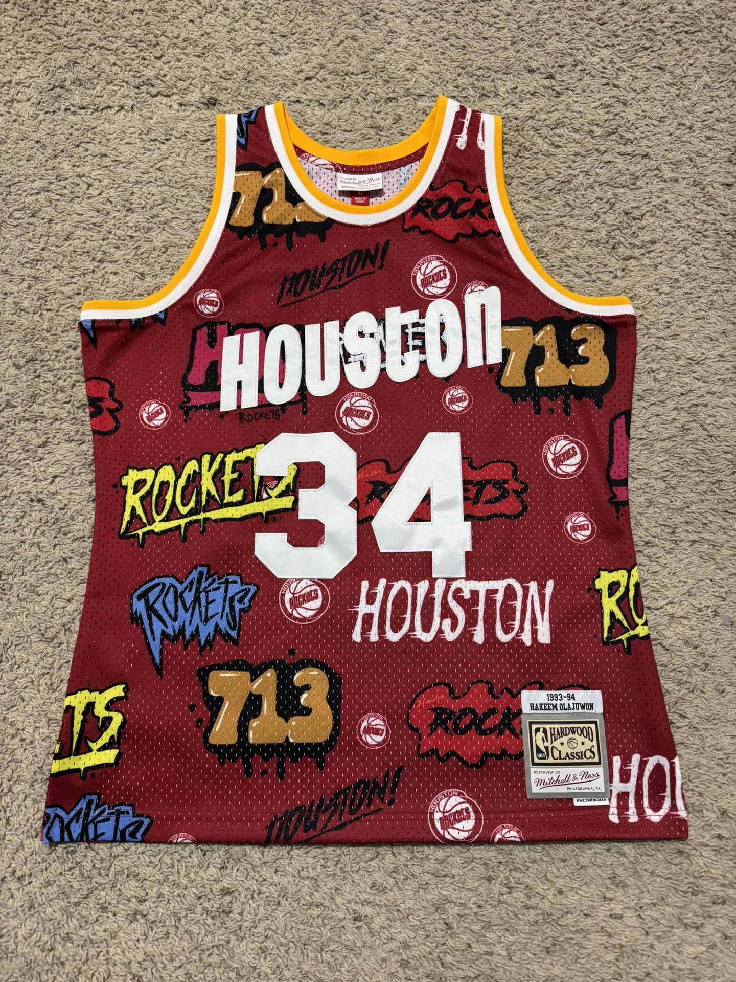 93-94 Hakeem Olajuwon #34 Rockets Mens Mitchell & Ness Swingman Slap Jersey