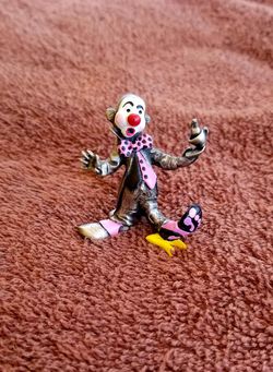 Pewter Clown slipping on a banana