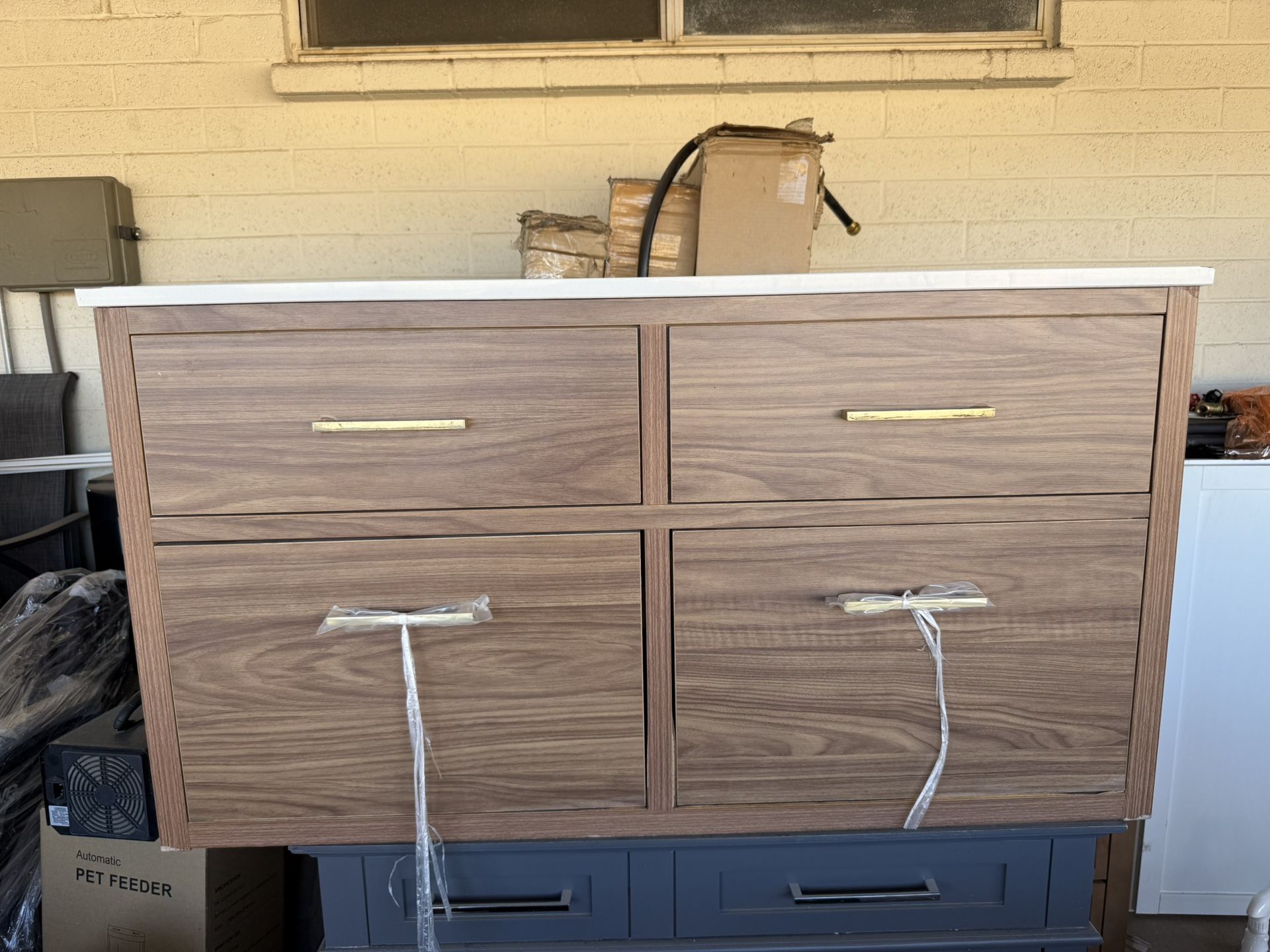 Brown Vanity with Top 42in W x 22in D x 33in H has cosmetic damage (see pics)