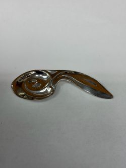 sterling silver baby spoon with a rabbit-ear handle and swirl bowl