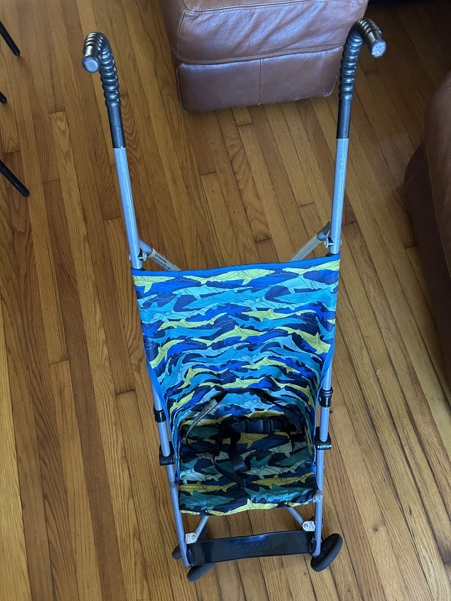 Cosco Umbrella Stroller With Blue Sharks On It
