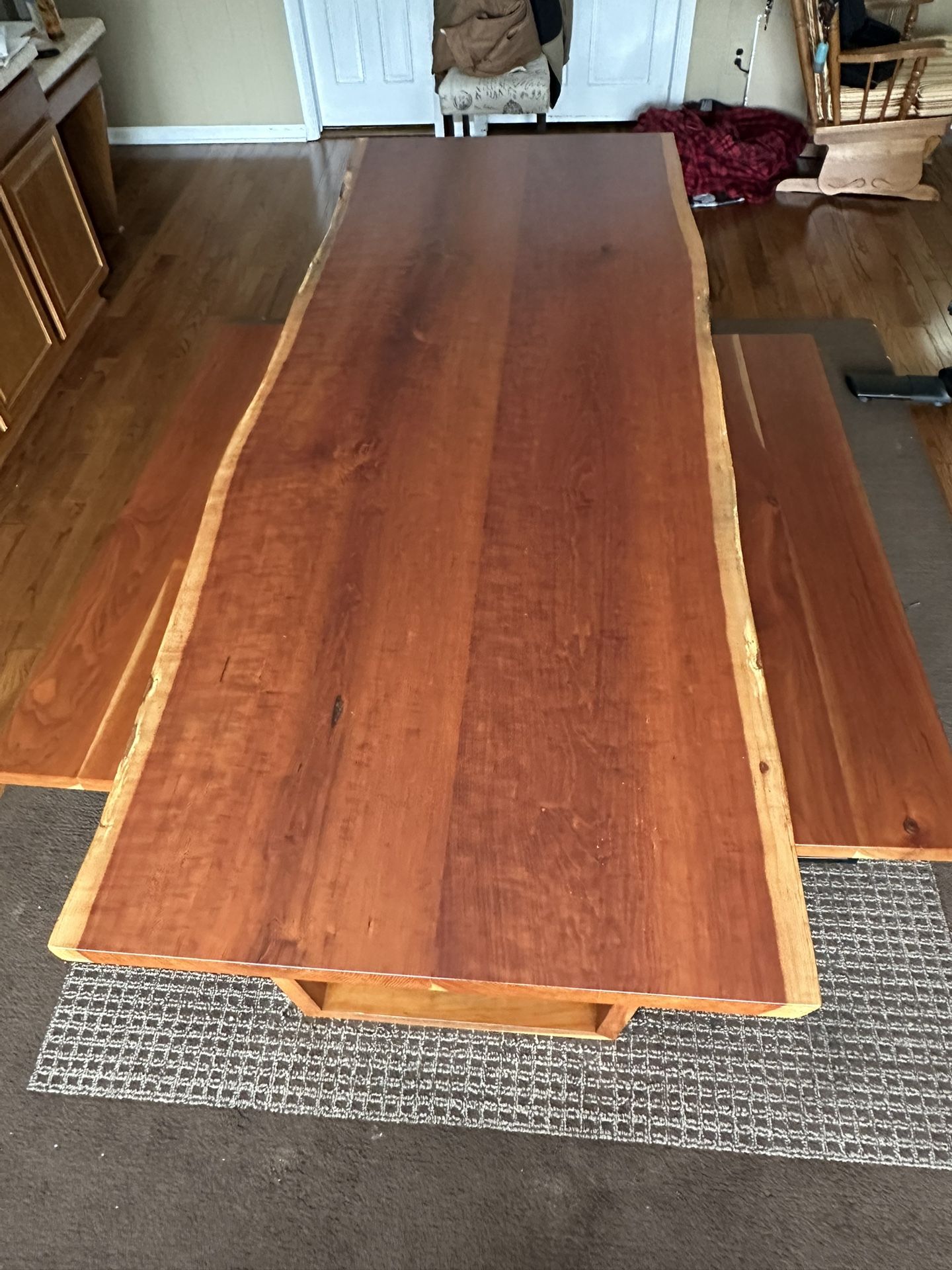 Solid cherry live edge dining room table with two benches