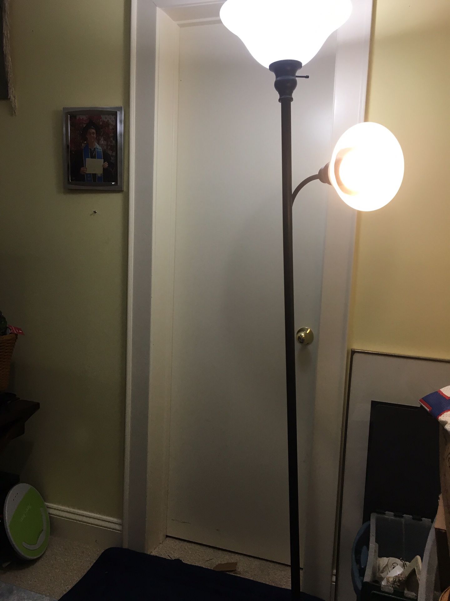 Floor lamps with two lights -1 fixed toward ceiling & other adjustable for tasks.