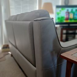 Yeah , elevate your home with this elegant gray leather love seat design for total relaxation