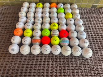 64 mixed used golf balls