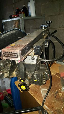 Craftsman radial arm saw and stand with saw blades