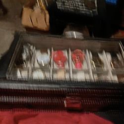 I Have This Beautiful Watch Case Holds 12 Watches And It Come With 12 Watches Clear On Top Very Nice Leather I Think