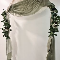 Gold Wedding Arch Backdrop Stand Included with Faux Green Leave Embellishments and Seafoam and Cream Drapery 