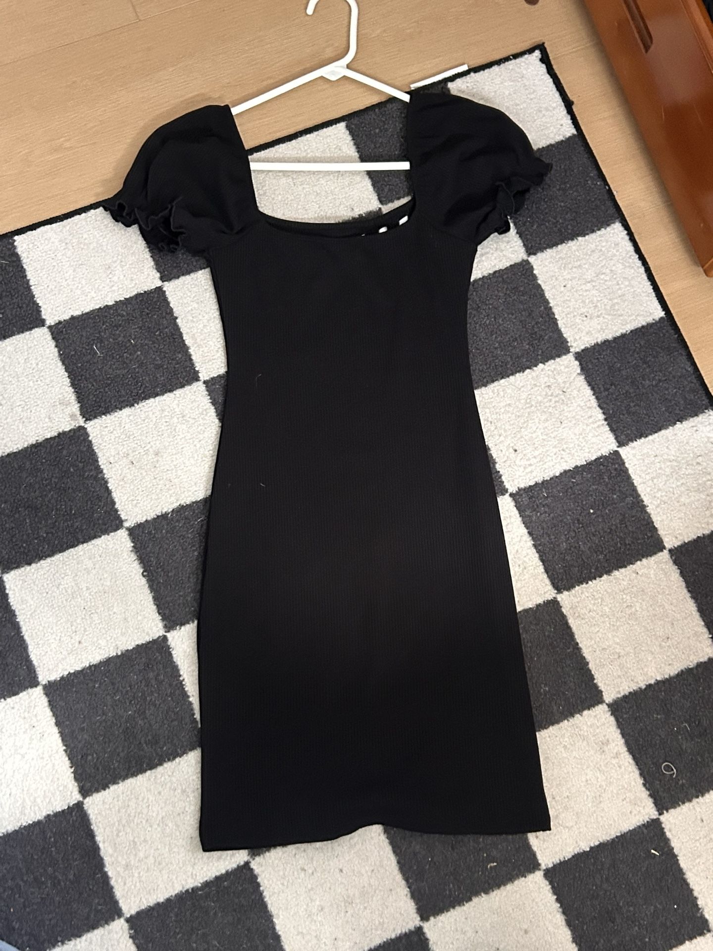 ribbed mini dress featuring puff sleeves and a white bow detail