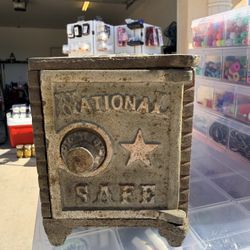 Vintage “National Safe” cast iron coin bank with incredible natural rust patina.