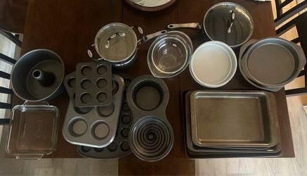 Lots of baking dishes, couple pans with lids, 2 glass mixing bows