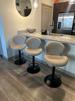 Three Matching Swivel Barstools