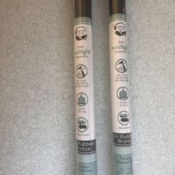 Zenna Home Adjustable Tension Shower Rod in a rubbed bronze finish.