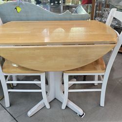2 seater drop leaf dining table. With the leaves up, it's a 40" round