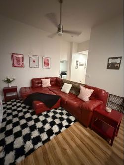 Red leather couch with ottoman
