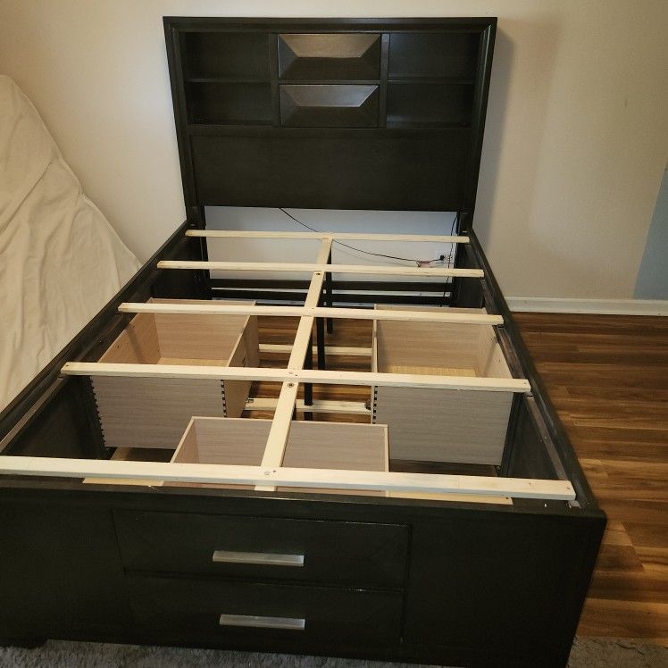 "Double" Mattress Bed Frame With 3 Oversized Drawers And 2 Phone Plug Ins On Headboard. Measures 85.5"L , 56.5"W, Headboard Stands 58" in Tall .