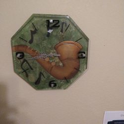 sax. clock.  glass face. works. great. AAA battery. 