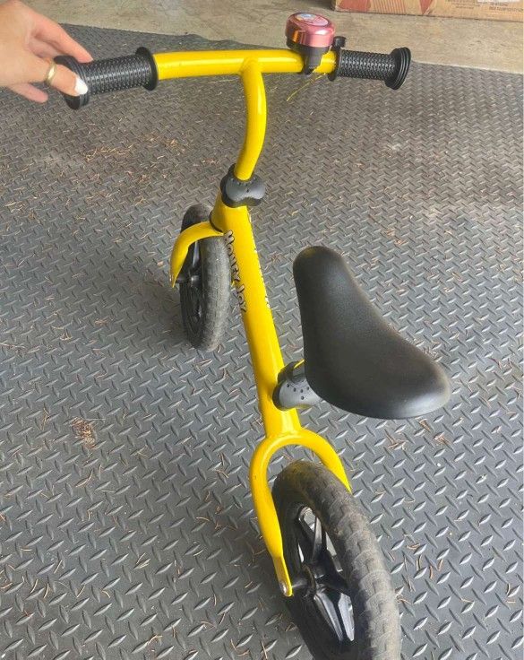 Yellow toddler balance bike