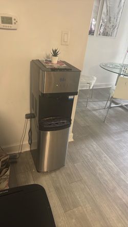 Brio water dispenser plus 3 water bottles (5 gallon each)