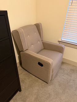Gray swivel rocking chair