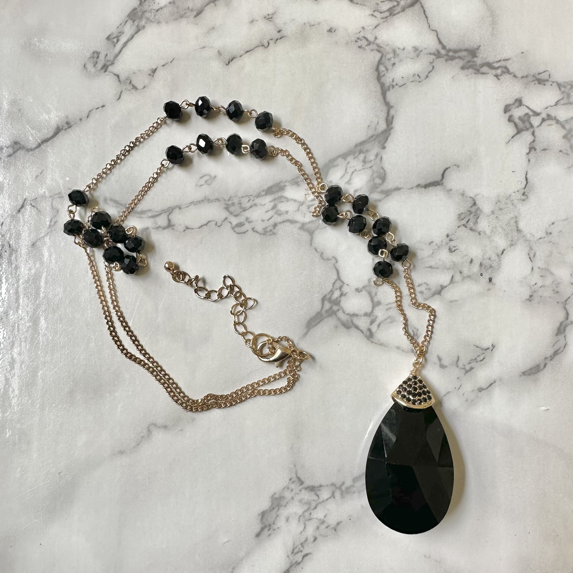 Black And Gold Tone Long Teardrop Pendant Necklace