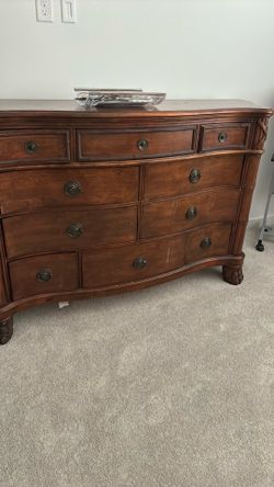 Beautiful 10 drawer dresser with side enclosed shelves