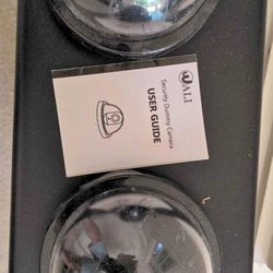 Pair of fake battery-powered security cameras