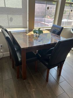 Dining table with 4 faux leather black chairs