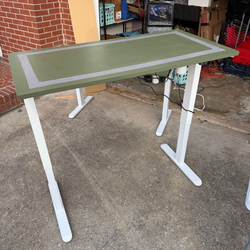 Green power sit to stand desk