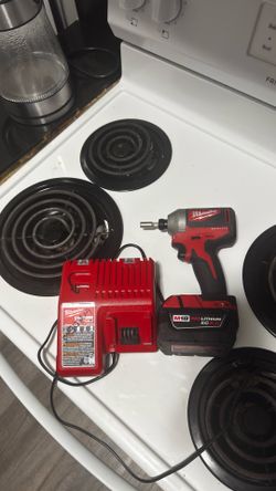 Milwaukee brushless impact drill and charger