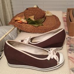 ChocolateBrown canvas with shoestring ties white trim brass logo white rubber bottom